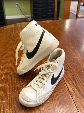Nike White High-Top Sneakers with Black Swoosh Accent